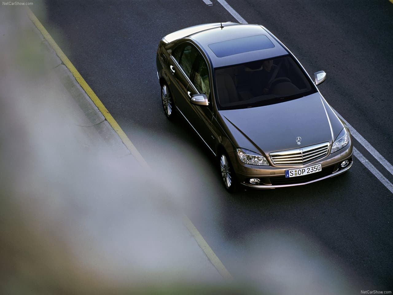 Top down view of car driving on asphalt