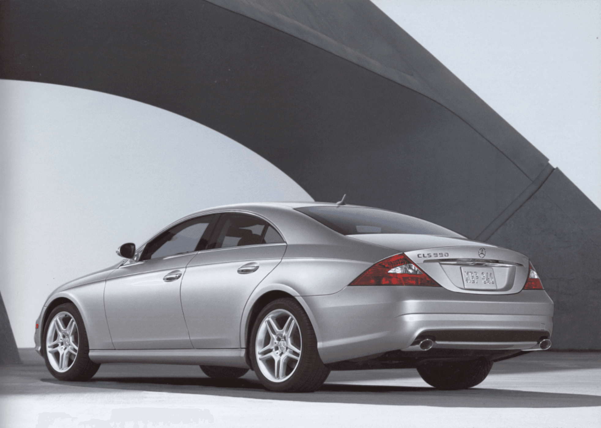 Car under concrete archway