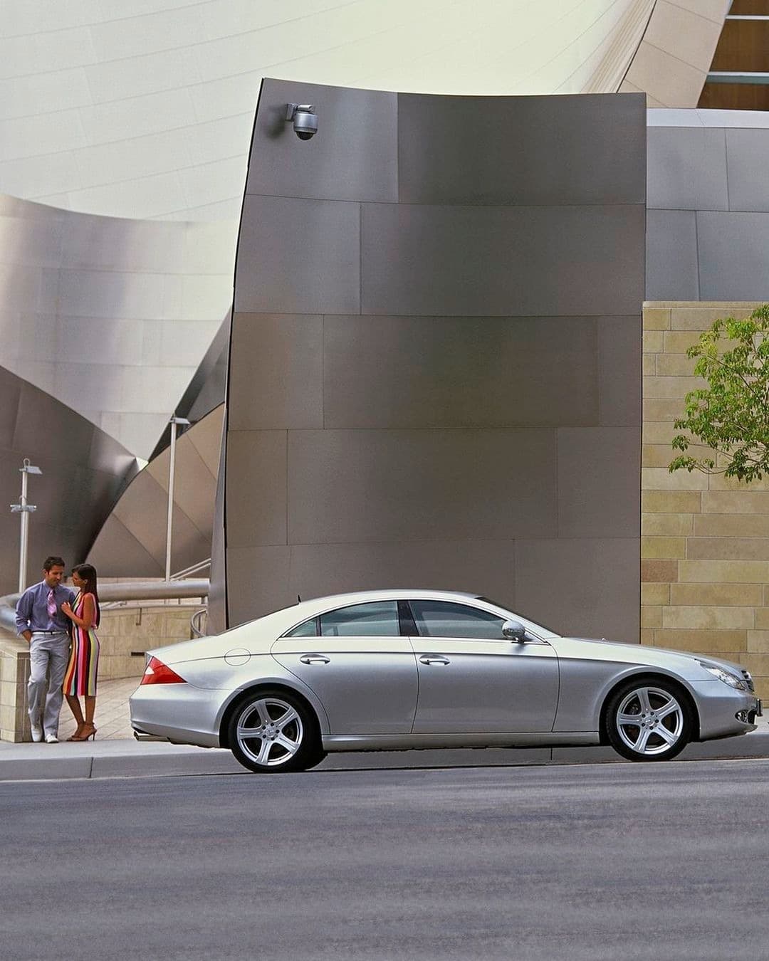 Silver CLS side profile against concrete wall