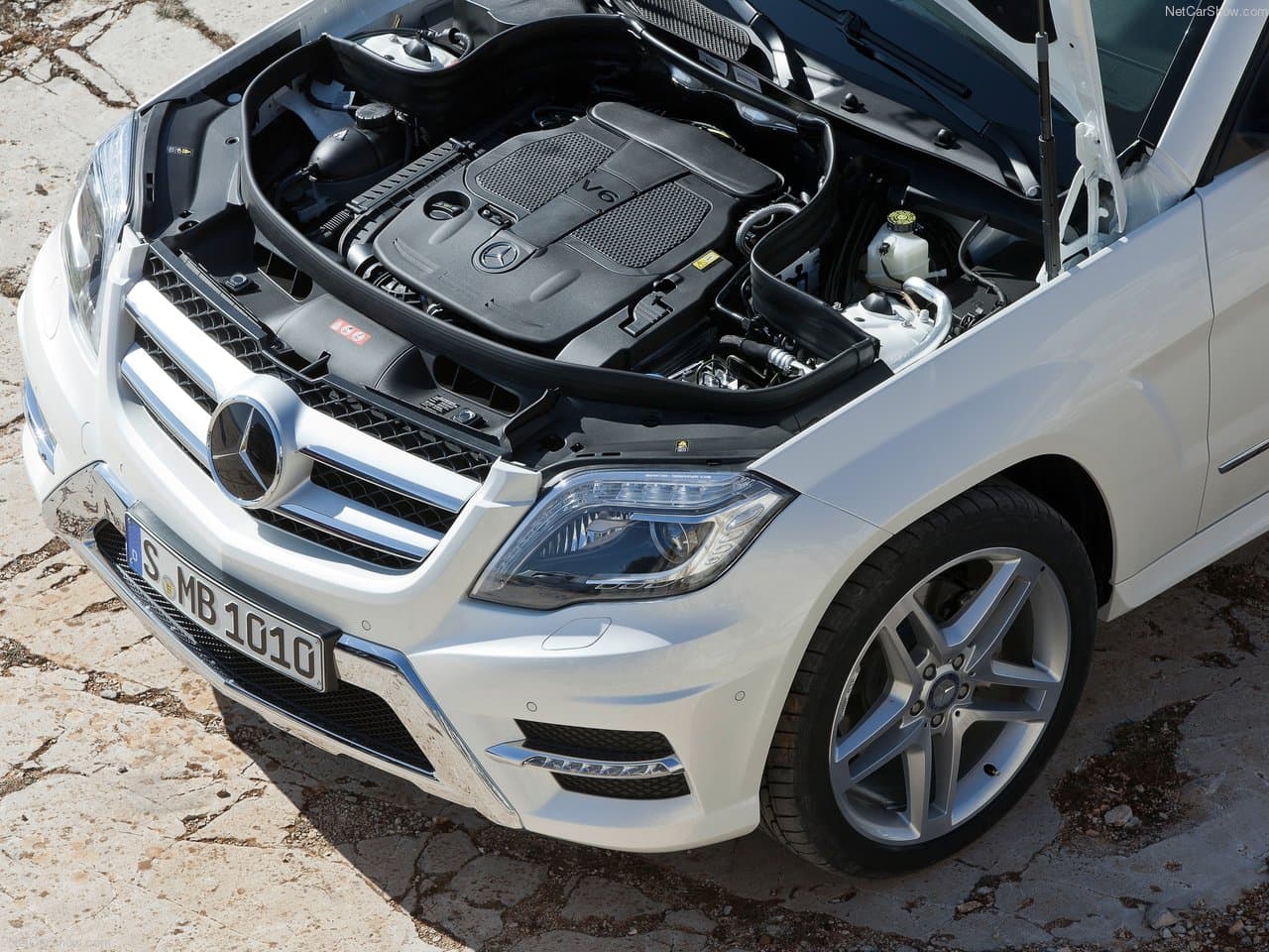 Engine bay with hood open showing V6 engine